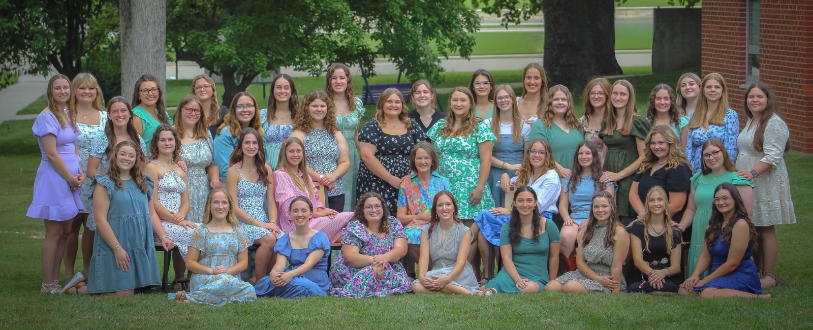 Photo of women of Clovia in yard